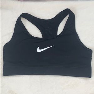 A classic, black, t-back Nike sports bra